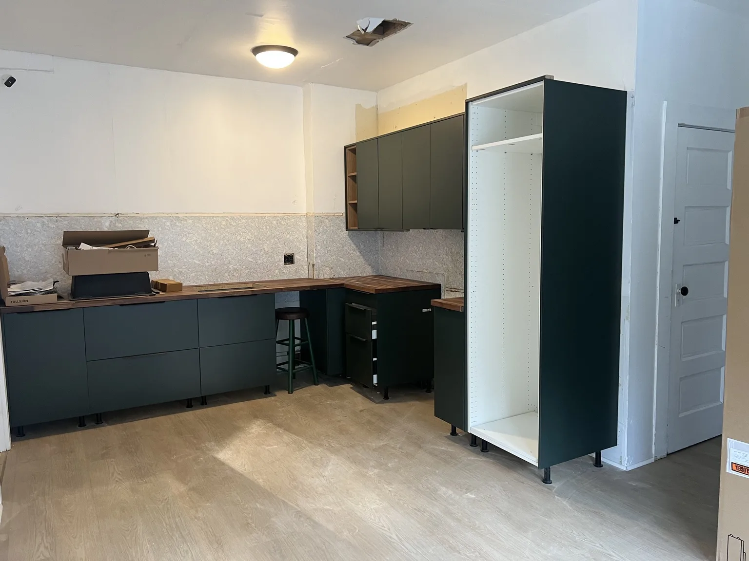 IKEA kitchen installation near White Plains, NY — Dark Green Kitchen with Wood Accents
